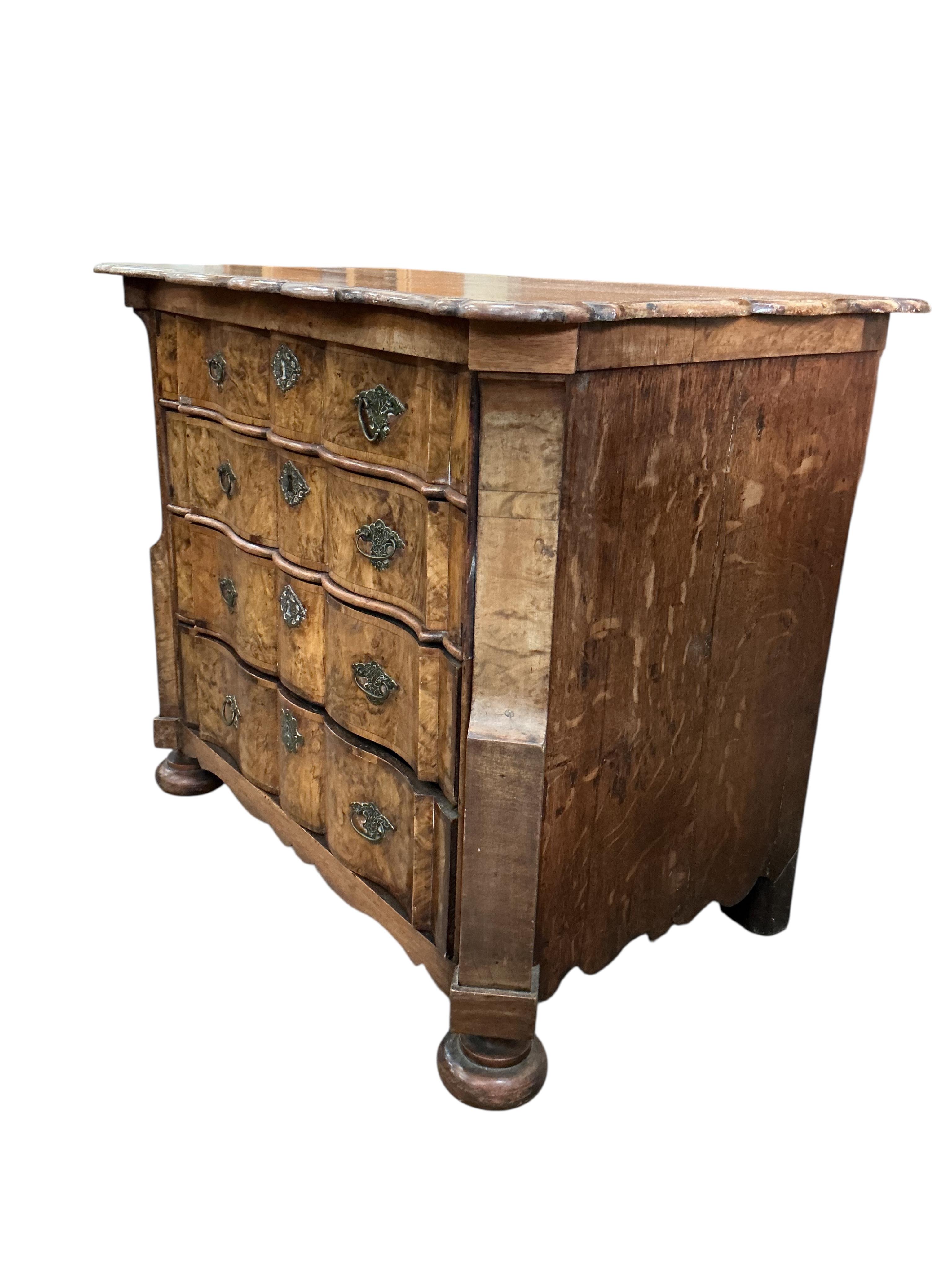 An 18th century Dutch walnut and oak serpentine chest, width 92cm, depth 57cm, height 78cm